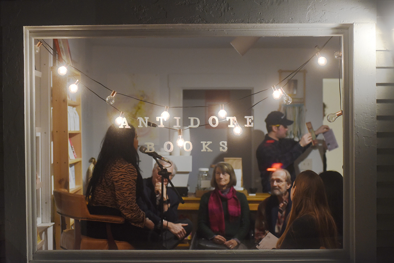 Antidote Books' Ruth Rodriguez speaks to the crowd before a poetry reading in March. 